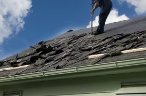 Worker repairing roof